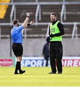 3 March 2024; Kildare backroom team member Ronan Sweeney is shown the yellow card by referee David Gough during the Allianz Football League Division 2 match between Cork and Kildare at SuperValu Páirc Ui Chaoimh in Cork. Photo by Piaras Ó Mídheach/Sportsfile