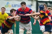 3 March 2024; Eddie Rees of Clontarf FC in action against Andrew Quinn, right, and Noah Maguire of Lansdowne FC during the JP Fanagan League match between Lansdowne FC and Clontarf FC at Lansdowne RFC in Dublin. Photo by Tyler Miller/Sportsfile
