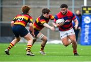 3 March 2024; Conor Bateman of Clontarf FC in action against Noah Maguire, centre, and Tom Bohan of Lansdowne FC during the JP Fanagan League match between Lansdowne FC and Clontarf FC at Lansdowne RFC in Dublin. Photo by Tyler Miller/Sportsfile