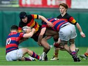 3 March 2024; Dylan O'Keeffe of Lansdowne FC is tackled by Samuel Wisniewski, left, and Daragh Doyle of Clontarf FC during the JP Fanagan League match between Lansdowne FC and Clontarf FC at Lansdowne RFC in Dublin. Photo by Tyler Miller/Sportsfile