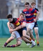 3 March 2024; Fiach Devitt of Lansdowne FC is tackled by Ciaran Bolger of Clontarf FC during the JP Fanagan League match between Lansdowne FC and Clontarf FC at Lansdowne RFC in Dublin. Photo by Shauna Clinton/Sportsfile