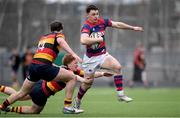 3 March 2024; Samuel Wisniewski of Clontarf FC in action against Tom Bohan, centre, and Jamie Maguire of Lansdowne FC during the JP Fanagan League match between Lansdowne FC and Clontarf FC at Lansdowne RFC in Dublin. Photo by Shauna Clinton/Sportsfile
