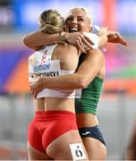 3 March 2024; Pia Skrzyszowska of Poland, left, is congratulated on winning bronze by Sarah Lavin of Ireland after the Women's 60m Hurdles Final day three of the World Indoor Athletics Championships 2024 at Emirates Arena in Glasgow, Scotland. Photo by Sam Barnes/Sportsfile