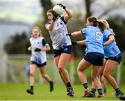 3 March 2024; Eve Power of Waterford in action against Dublin players Aoife Kane, 5, and Ellen Gribben during the Lidl LGFA National League Division 1 Round 5 match between Waterford and Dublin at Fraher Field in Dungarvan, Waterford. Photo by Seb Daly/Sportsfile