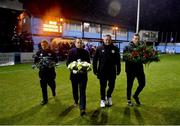 4 March 2024; In attendance, from left, Drogheda United kit manager Barry Sanfey, League of Ireland director Mark Scanlon, FAI kit manager Stephen Egan and Bohemians kit manager Colin O'Connor make their way to the centre circle to place wreaths in memory of the late former Drogehda United kit manager Brendan Penrose before the SSE Airtricity Men's Premier Division match between Drogheda United and Bohemians at Weavers Park in Drogheda, Louth. Photo by Ben McShane/Sportsfile