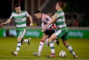 4 March 2024; Jordan McEneff of Derry City in action against Daniel Cleary of Shamrock Rovers during the SSE Airtricity Men's Premier Division match between Shamrock Rovers and Derry City at Tallaght Stadium in Dublin. Photo by David Fitzgerald/Sportsfile