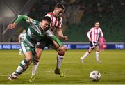 4 March 2024; Darragh Burns of Shamrock Rovers in action against Ben Doherty of Derry City during the SSE Airtricity Men's Premier Division match between Shamrock Rovers and Derry City at Tallaght Stadium in Dublin. Photo by David Fitzgerald/Sportsfile
