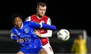 4 March 2024; Maleace Asamoah of Waterford in action against Jamie Lennon of St Patrick's Athletic during the SSE Airtricity Men's Premier Division match between Waterford and St Patrick's Athletic at the Regional Sports Centre in Waterford. Photo by Piaras Ó Mídheach/Sportsfile