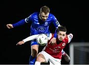 4 March 2024; Ruairí Keating of St Patrick's Athletic in action against Rowan McDonald of Waterford during the SSE Airtricity Men's Premier Division match between Waterford and St Patrick's Athletic at the Regional Sports Centre in Waterford. Photo by Piaras Ó Mídheach/Sportsfile