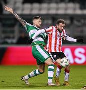 4 March 2024; Paul McMullan of Derry City in action against Lee Grace of Shamrock Rovers during the SSE Airtricity Men's Premier Division match between Shamrock Rovers and Derry City at Tallaght Stadium in Dublin. Photo by Stephen McCarthy/Sportsfile