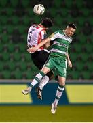 4 March 2024; Gary O'Neill of Shamrock Rovers in action against Patrick Hoban of Derry City during the SSE Airtricity Men's Premier Division match between Shamrock Rovers and Derry City at Tallaght Stadium in Dublin. Photo by David Fitzgerald/Sportsfile