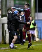 4 March 2024; Evan Weir of Drogheda United celebrates with Drogheda United assistant manager Daire Doyle, left, after scoring their side's second goal during the SSE Airtricity Men's Premier Division match between Drogheda United and Bohemians at Weavers Park in Drogheda, Louth. Photo by Ben McShane/Sportsfile