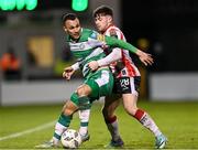 4 March 2024; Graham Burke of Shamrock Rovers in action against Adam O'Reilly of Derry City during the SSE Airtricity Men's Premier Division match between Shamrock Rovers and Derry City at Tallaght Stadium in Dublin. Photo by Stephen McCarthy/Sportsfile