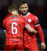 4 March 2024; Paddy Barrett of Shelbourne celebrates with teammate JJ Lunney after their victory in the SSE Airtricity Men's Premier Division match between Shelbourne and Galway United at Tolka Park in Dublin. Photo by Harry Murphy/Sportsfile