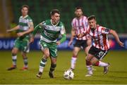 4 March 2024; Darragh Burns of Shamrock Rovers in action against Danny Mullen of Derry City during the SSE Airtricity Men's Premier Division match between Shamrock Rovers and Derry City at Tallaght Stadium in Dublin. Photo by David Fitzgerald/Sportsfile