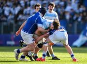 5 March 2024; Thomas Butler of Blackrock College is tackled by James Molloy, left, and Patrick Power of St Mary’s College during the Bank of Ireland Leinster Schools Senior Cup semi-final match between Blackrock College and St Mary's College at Energia Park in Dublin. Photo by Daire Brennan/Sportsfile
