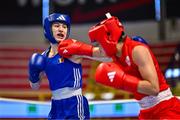 6 March 2024; Ayaka Taguchi of Japan, right, in action against Andreea Marin Loredana of Romania during their Women's 60kg Round of 16 bout during day four at the Paris 2024 Olympic Boxing Qualification Tournament at E-Work Arena in Busto Arsizio, Italy. Photo by Ben McShane/Sportsfile