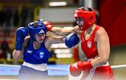 6 March 2024; Karolina Makhno of Ukraine, right, in action against Vasiliki Stavridou of Greece during their Women's 75kg Round of 32 bout during day four at the Paris 2024 Olympic Boxing Qualification Tournament at E-Work Arena in Busto Arsizio, Italy. Photo by Ben McShane/Sportsfile