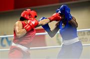 6 March 2024; Chantelle Reid of Great Britain, left, in action against Eyed Angel George of Trinidad & Tobago during their Women's 75kg Round of 32 bout during day four at the Paris 2024 Olympic Boxing Qualification Tournament at E-Work Arena in Busto Arsizio, Italy. Photo by Ben McShane/Sportsfile