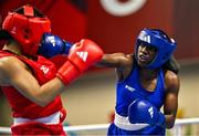 6 March 2024; Chantelle Reid of Great Britain, left, in action against Eyed Angel George of Trinidad & Tobago during their Women's 75kg Round of 32 bout during day four at the Paris 2024 Olympic Boxing Qualification Tournament at E-Work Arena in Busto Arsizio, Italy. Photo by Ben McShane/Sportsfile
