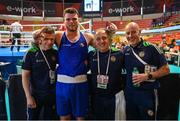 6 March 2024; Martin McDonagh of Ireland celebrates with coaches, from left, James Doyle, Zaur Antia and Damian Kennedy after his Men's 92kg+ Round of 32 bout against Yusuf Acik of Türkiye during day four at the Paris 2024 Olympic Boxing Qualification Tournament at E-Work Arena in Busto Arsizio, Italy. Photo by Ben McShane/Sportsfile