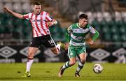 4 March 2024; Darragh Burns of Shamrock Rovers in action against Ben Doherty of Derry City during the SSE Airtricity Men's Premier Division match between Shamrock Rovers and Derry City at Tallaght Stadium in Dublin. Photo by Stephen McCarthy/Sportsfile