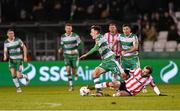 4 March 2024; Darragh Burns of Shamrock Rovers is tackled by Paul McMullan of Derry City during the SSE Airtricity Men's Premier Division match between Shamrock Rovers and Derry City at Tallaght Stadium in Dublin. Photo by Stephen McCarthy/Sportsfile