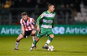 4 March 2024; Graham Burke of Shamrock Rovers in action against Ronan Boyce of Derry City during the SSE Airtricity Men's Premier Division match between Shamrock Rovers and Derry City at Tallaght Stadium in Dublin. Photo by Stephen McCarthy/Sportsfile