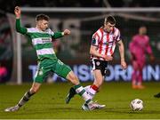 4 March 2024; Daniel Kelly of Derry City in action against Markus Poom of Shamrock Rovers during the SSE Airtricity Men's Premier Division match between Shamrock Rovers and Derry City at Tallaght Stadium in Dublin. Photo by Stephen McCarthy/Sportsfile