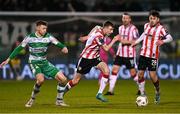 4 March 2024; Daniel Kelly of Derry City in action against Markus Poom of Shamrock Rovers during the SSE Airtricity Men's Premier Division match between Shamrock Rovers and Derry City at Tallaght Stadium in Dublin. Photo by Stephen McCarthy/Sportsfile