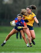7 March 2024; Sarah Fitzgerald of Mary Immaculate College in action against Isobel English of DCU Dochas Eireann during the 2024 Ladies HEC Cup final match between DCU Dochas Eireann and Mary Immaculate College at MTU Cork. Photo by Stephen Marken/Sportsfile