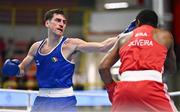 7 March 2024; Aidan Walsh of Ireland, left, in action against Wanderson De Oliveira of Brazil during their Men's 71kg Round of 32 bout during day five at the Paris 2024 Olympic Boxing Qualification Tournament at E-Work Arena in Busto Arsizio, Italy. Photo by Ben McShane/Sportsfile