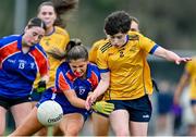 7 March 2024; Sarah Fitzgerald of Mary Immaculate College in action against Jess Collier of DCU Dochas Eireann during the 2024 Ladies HEC Cup final match between DCU Dochas Eireann and Mary Immaculate College at MTU Cork. Photo by Stephen Marken/Sportsfile