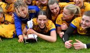 7 March 2024; DCU Dochas Eireann captain Louise Pearl, centre, and her teammates celebrate with the cup after their side's victory in the 2024 Ladies HEC Cup final match between DCU Dochas Eireann and Mary Immaculate College at MTU Cork. Photo by Stephen Marken/Sportsfile