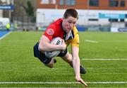 7 March 2024; Tadg Young of St Fintan's High School dives over to score his side's first try during the Bank of Ireland Vinnie Murray Cup final match between St Fintan's High School and The High School at Energia Park in Dublin. Photo by Tyler Miller/Sportsfile