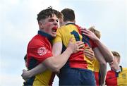 7 March 2024; Oisin Kelly of St Fintan's High School, left, celebrates with team-mate Tadg Young after he scored their side's first try during the Bank of Ireland Vinnie Murray Cup final match between St Fintan's High School and The High School at Energia Park in Dublin. Photo by Tyler Miller/Sportsfile