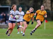 7 March 2024; Carla McKenna of Ulster University in action against Grace Flanagan of DCU Dochas Eireann during the 2024 Ladies HEC Lagan Cup final match between DCU Dochas Eireann and Ulster University, Belfast at MTU Cork. Photo by Stephen Marken/Sportsfile