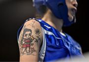 7 March 2024; A detailed view of the tattoo of Hsiao Wen Huang of Chinese Taipei during their Women's 54kg Round of 32 bout against Denisse Bravo of Chile during day five at the Paris 2024 Olympic Boxing Qualification Tournament at E-Work Arena in Busto Arsizio, Italy. Photo by Ben McShane/Sportsfile