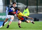 7 March 2024; Ted Duke of The High School in action against Oisin Kelly of St Fintan's High School during the Bank of Ireland Vinnie Murray Cup final match between St Fintan's High School and The High School at Energia Park in Dublin. Photo by Tyler Miller/Sportsfile