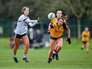 7 March 2024; Cora McCaughey of Ulster University in action against Anna Lyons of DCU Dochas Eireann during the 2024 Ladies HEC Lagan Cup final match between DCU Dochas Eireann and Ulster University, Belfast at MTU Cork. Photo by Stephen Marken/Sportsfile