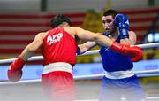 7 March 2024; Ahmed Azam Shehzad of Afghanistan, left, in action against Salvador Flores Luque of Spain during their Men's 63.5kg Round of 32 bout during day five at the Paris 2024 Olympic Boxing Qualification Tournament at E-Work Arena in Busto Arsizio, Italy. Photo by Ben McShane/Sportsfile