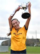 7 March 2024; Hannah McHugh of DCU Dochas Eireann lifts the cup after the 2024 Ladies HEC Lagan Cup final match between DCU Dochas Eireann and Ulster University, Belfast at MTU Cork. Photo by Stephen Marken/Sportsfile