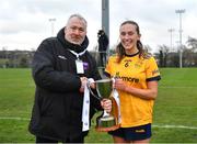 7 March 2024; DCU Dochas Eireann captain Hannah McHugh is presented with the Cup by Daniel Caldwell, Chairperson Ladies HEC, following the 2024 Ladies HEC Lagan Cup Final between DCU Dochas Eireann and Ulster University Belfast at MTU Cork Photo by Stephen Marken/Sportsfile