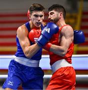 7 March 2024; Ali Habibinezhad of Iran, right, in action against Patris Mughalzai of Great Britain during their Men's 63.5kg Round of 32 bout during day five at the Paris 2024 Olympic Boxing Qualification Tournament at E-Work Arena in Busto Arsizio, Italy. Photo by Ben McShane/Sportsfile