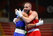 7 March 2024; Mohamed Rachem of Belgium, right, and Omari Jones of USA embrace after their Men's 71kg Round of 32 bout during day five at the Paris 2024 Olympic Boxing Qualification Tournament at E-Work Arena in Busto Arsizio, Italy. Photo by Ben McShane/Sportsfile