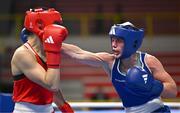 8 March 2024; Grainne Walsh of Ireland, right, in action against Stefanie Von Berge of Germany during their Women's 66kg Round of 32 bout against during day six at the Paris 2024 Olympic Boxing Qualification Tournament at E-Work Arena in Busto Arsizio, Italy. Photo by Ben McShane/Sportsfile