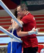 8 March 2024; Grainne Walsh of Ireland, left, is congratulated by Germany coach Eddie Bolger after her victory in the Women's 66kg Round of 32 bout against Stefanie Von Berge of Germany during day six at the Paris 2024 Olympic Boxing Qualification Tournament at E-Work Arena in Busto Arsizio, Italy. Photo by Ben McShane/Sportsfile
