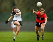 8 March 2024; Lauren Garland of Ulster University scores a first half point, despite pressure from Dara Kiniry of University College Cork during the 2024 Ladies HEC O’Connor Cup semi-final match between University College Cork and Ulster University at MTU Cork. Photo by Stephen Marken/Sportsfile