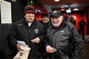 8 March 2024; Bohemians half-time raffle ticket seller Jimmy O'Connor, left, and Charles Mooney before the SSE Airtricity Men's Premier Division match between Bohemians and Shelbourne at Dalymount Park in Dublin. Photo by Stephen McCarthy/Sportsfile