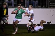 8 March 2024; Finn Treacy of Ireland evades the tackle of Ben Redshaw of England on his way to scoring his side's first try during the U20 Six Nations Rugby Championship match between England and Ireland at The Recreation Ground in Bath, England. Photo by Harry Murphy/Sportsfile